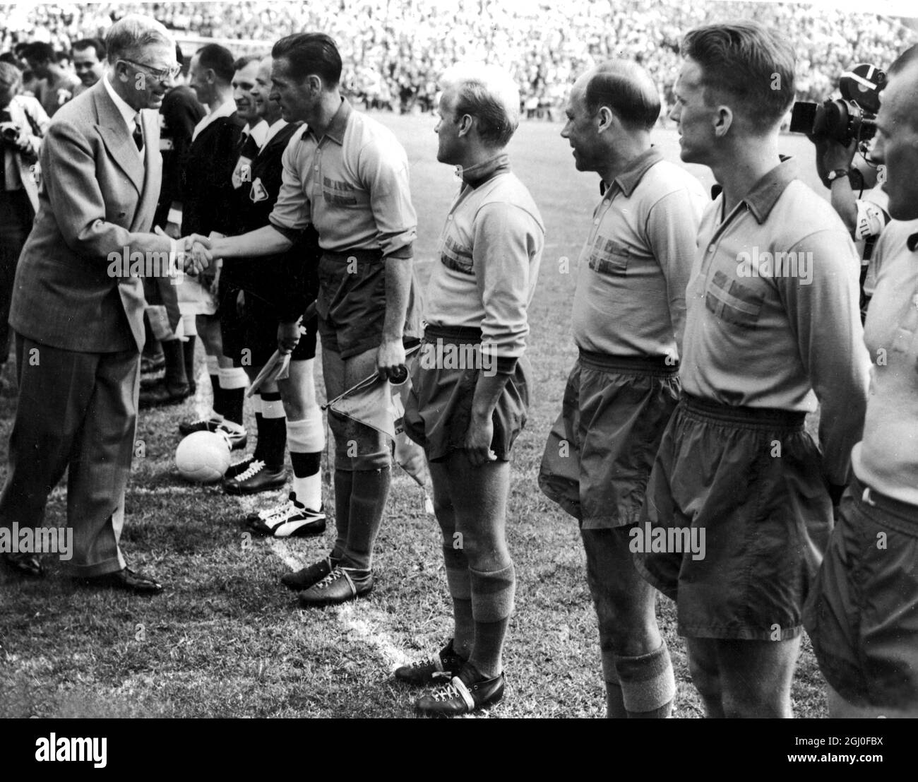 1958 World Cup Mexico v Sweden King Gustaf Adolf of Sweden shakes hands with members of the Swedish team at the Solna Stadium, Stockholm before the match. 10th June 1958. Stock Photo