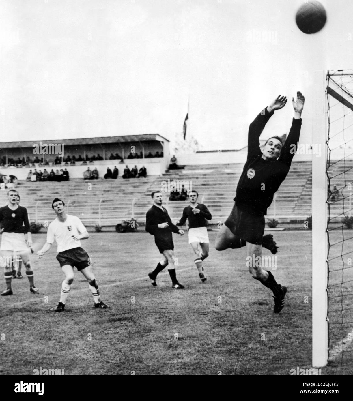 1962 World Cup England v Hungary England's Johnny Haynes watches as the Hungary goalkeeper jumps up to save the ball during the World Cup group match in Rancagua, Chile. 31st May 1962. Stock Photo