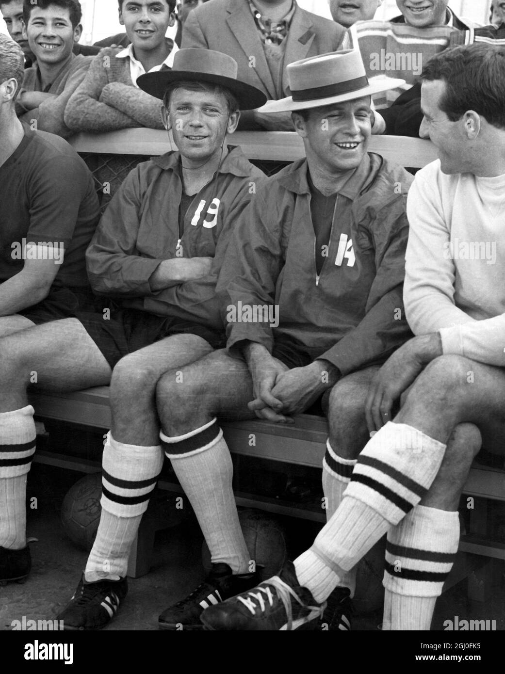 1962 World Cup Smiling footballers Gerry Hitchens (left) and Jimmy Armfield wearing native sombreros at training in Rancagua, Chile in preparation for the World Cup tournament. On the right is Ron Springett (England and Sheffield Wednesday goalkeeper). 28th May 1962. Stock Photo