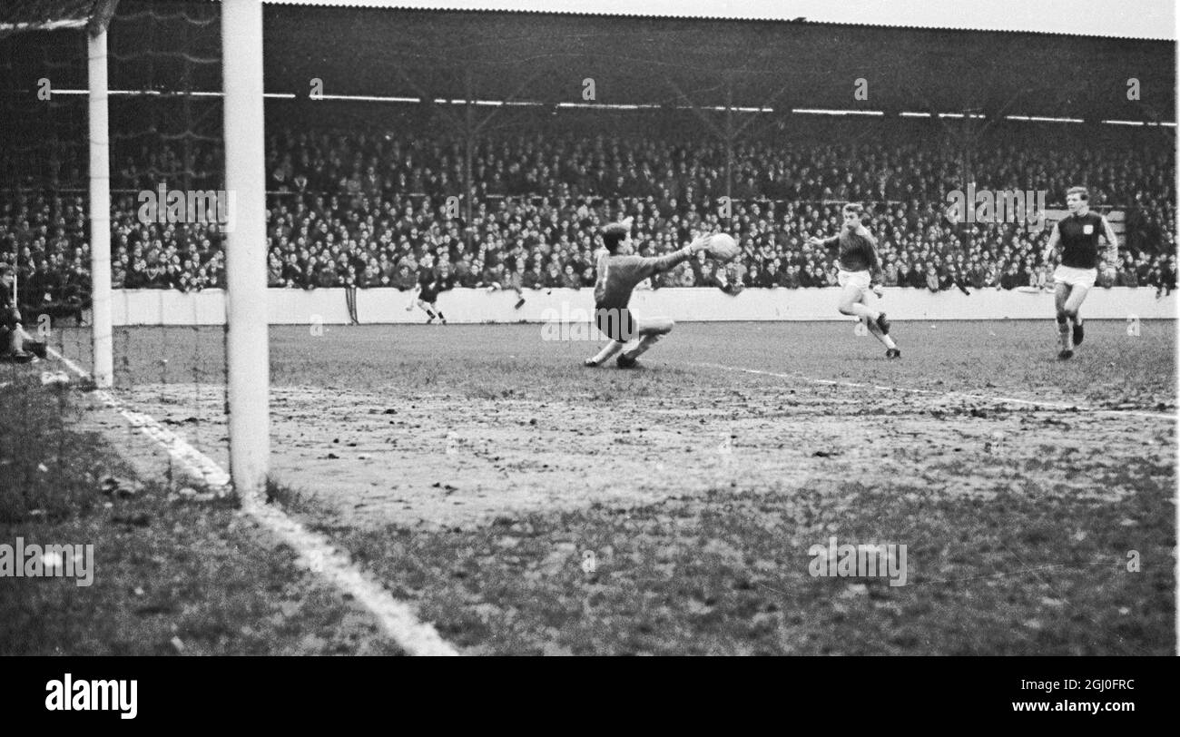 FA Cup 3rd Round West Ham United v Birmingham City Eddie Bovington of West Ham, gets his head to the ball to clear from a corner during FA Cup third round between the United and Birmingham City at Upton Park. Picture also shows Ken Brown, West Ham Captain and Geoff Vowden Birmingham Centre Forward. 9th January 1965 Stock Photo