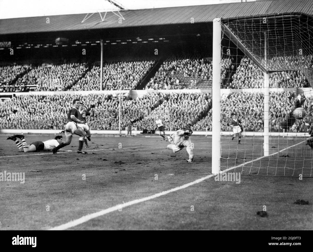 England v Wales England centre forward Smith beats Welsh goalkeeper