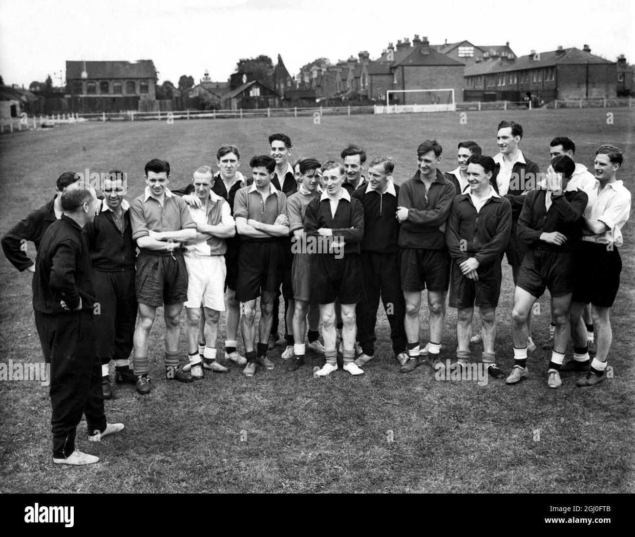 Britain's Olympic Footballers Tune Up Matt Busby (left) manager of Manchester United who is in charge of the players is seen talking to a party of Englishmen, Welshmen, Irishmen and Scotsmen - from which Great Britain's Olympic Team will be chosen. The party is now undergoing special training at Twyford in Berkshire. 22nd July 1948. Stock Photo