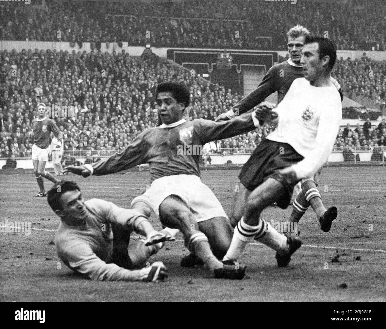 England v The Rest of the World Jimmy Greaves, the Spurs and England forward, scores the winning goal in the 86th minute to give England a well-deserved win over The Rest of the World team at Wembley. 23rd October 1963 Stock Photo