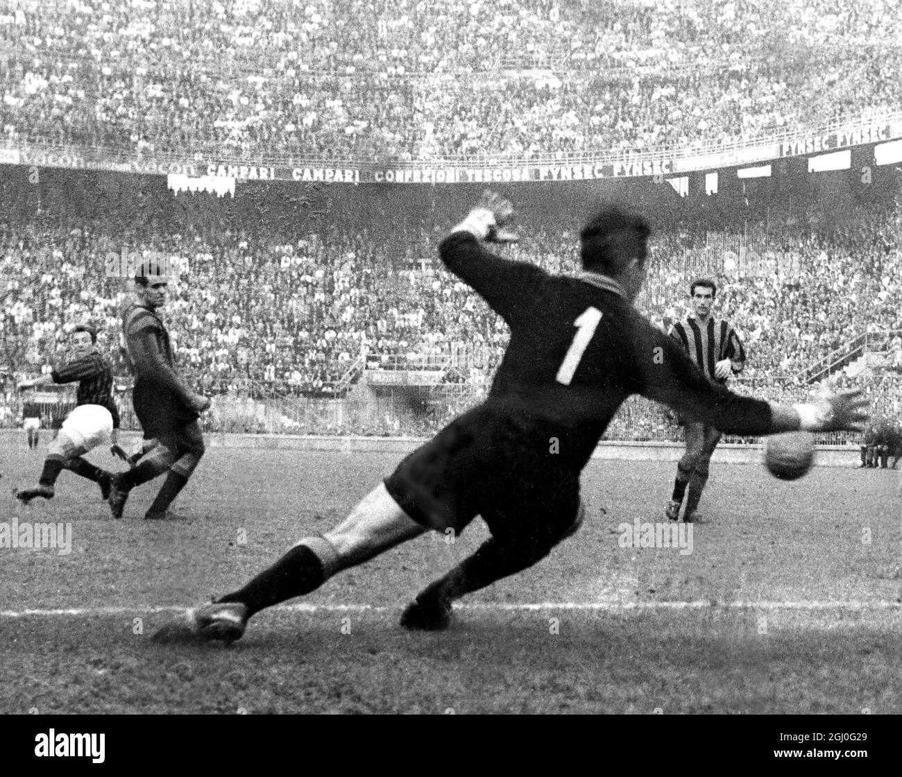 AC Milan v Inter Milan Jimmy Greaves of Milan, looks backwards as he scores the second goal against Inter-Milan's goalkeeper, Buffon. 1st October 1961 Stock Photo