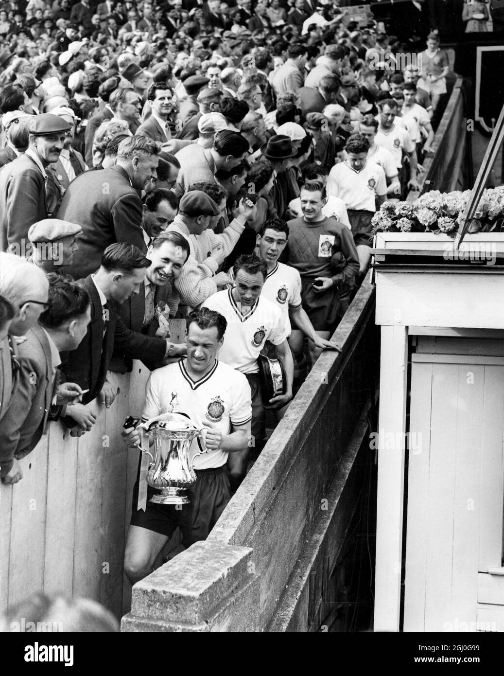 1958 FA Cup Final Manchester United v Bolton Wanderers Nat Lofthouse, the Bolton centre-forward and captain, leads his team down the steps, after the presentation by HRH Prince Philip. 3rd May 1958 Stock Photo
