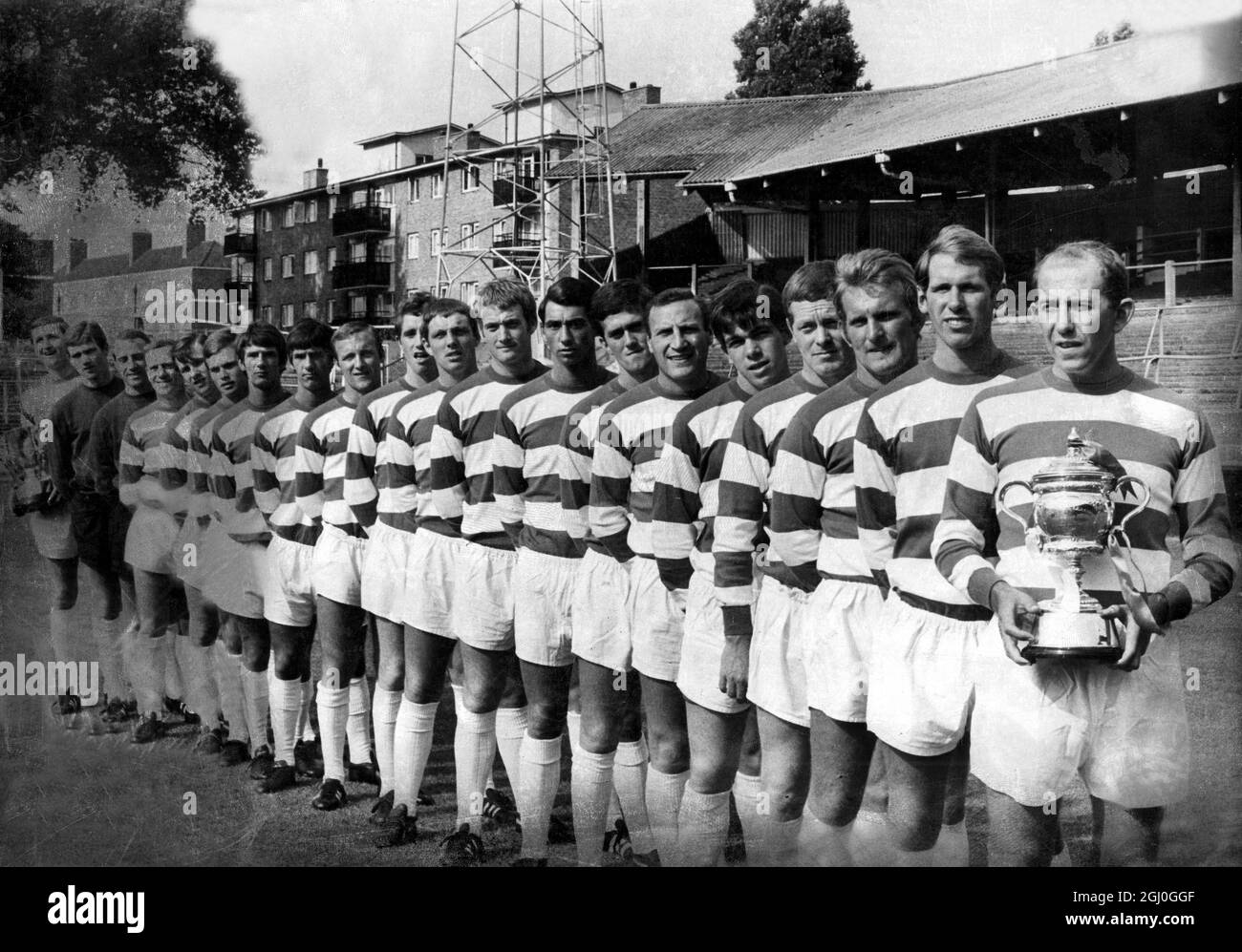 Queen's Park Rangers team line-up. Photo shows: (right - left) R. Sanderson (holding the third division trophy; M. Leach; B. Keetch; L. Allen; T. Hazell; M. Lazarus; C. Maughton; D. Clement; R. Marsh; R. Hunt; A. Wilks; A. Harris; R. Morgan; I. Morgan; B. Finch; I. Watson; J. Langley; R. Springett; M. Kelly; M. Keen (holding the football league cup) 20th July 1967 Stock Photo