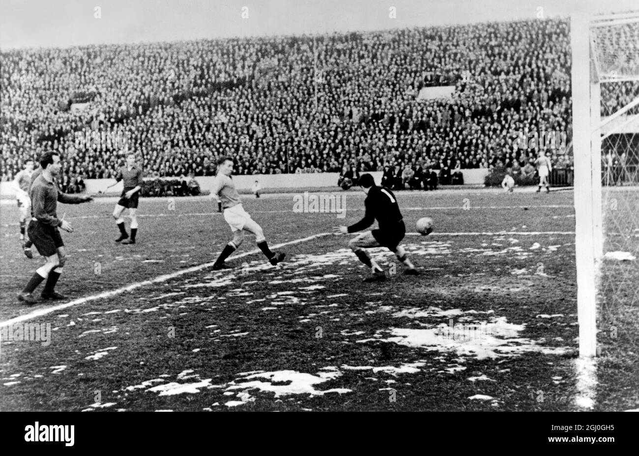 Red Star Belgrade v Manchester United Manchester United's Bobby Charlton scoring his team's third goal in their European Cup match in Belgrade. 5th February 1958 Stock Photo