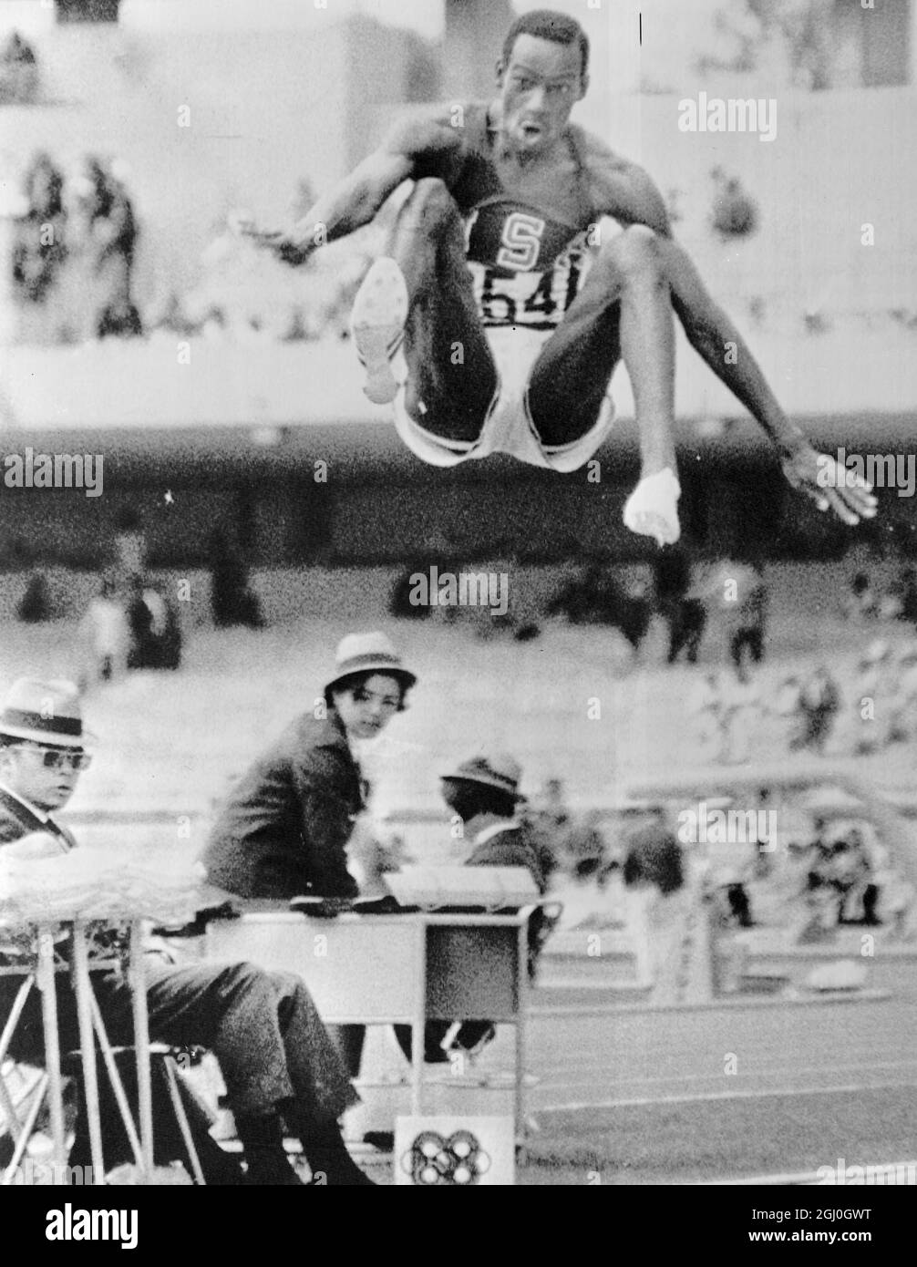 Bob Beamon of el Paso Texas USA in a prodigious leap which bettered the old world record by more than two feet leaps 29 feet 2 half inches at the mens long jump event to win Olympic Gold medal in the 19th Olympic Games 189 October Mexico City 1968 Stock Photo