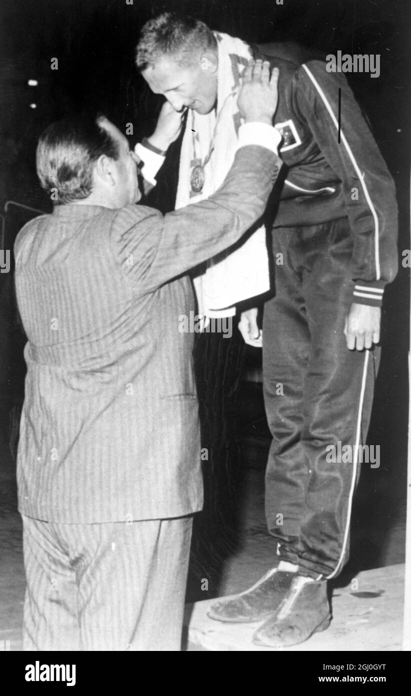 Rome: Mr Lews S. Luxton presenting Gold Medal to swimme r D. Heile of Australia for 100 Meter Backstroke at Olympic Games in Rome. 31 September 1960 Stock Photo
