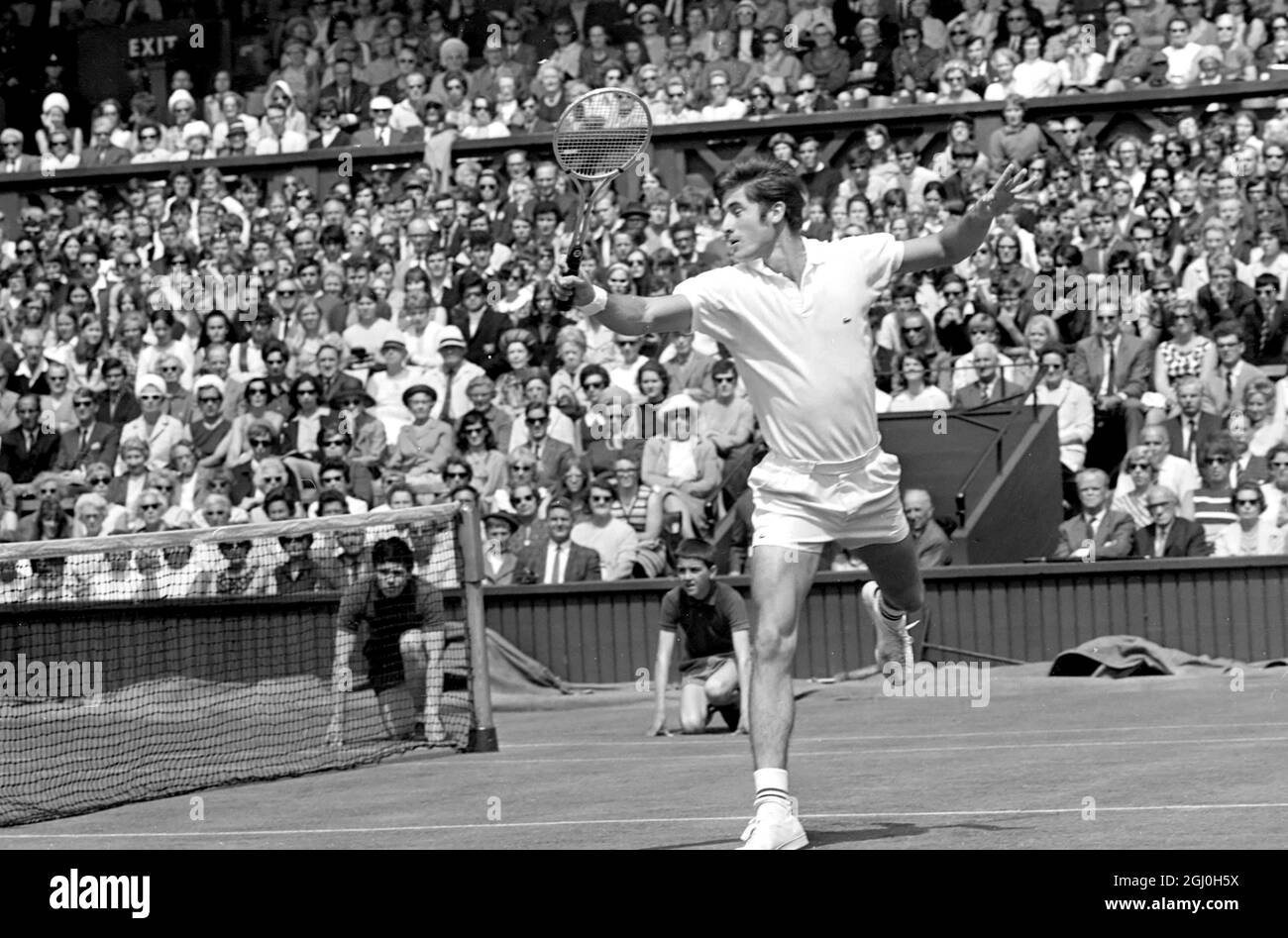 London: Charles Pasqarell, of Puerto Rico, in action against Pancho Gonzales, of Los Angeles, in the Mens Singles of the Wimbledon Tennis Championships. 25 June 1969 Stock Photo