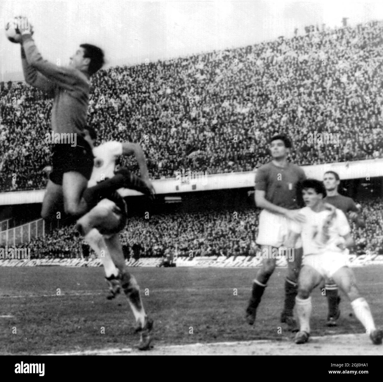 Naples, Italy: Action during todays Italy-Scotland World Cup Soccer Eliminator as Albertosi beat Yates to the ball and Facchetti and Forrest stand by. Italy won 3-0. 7 December 1965 Stock Photo