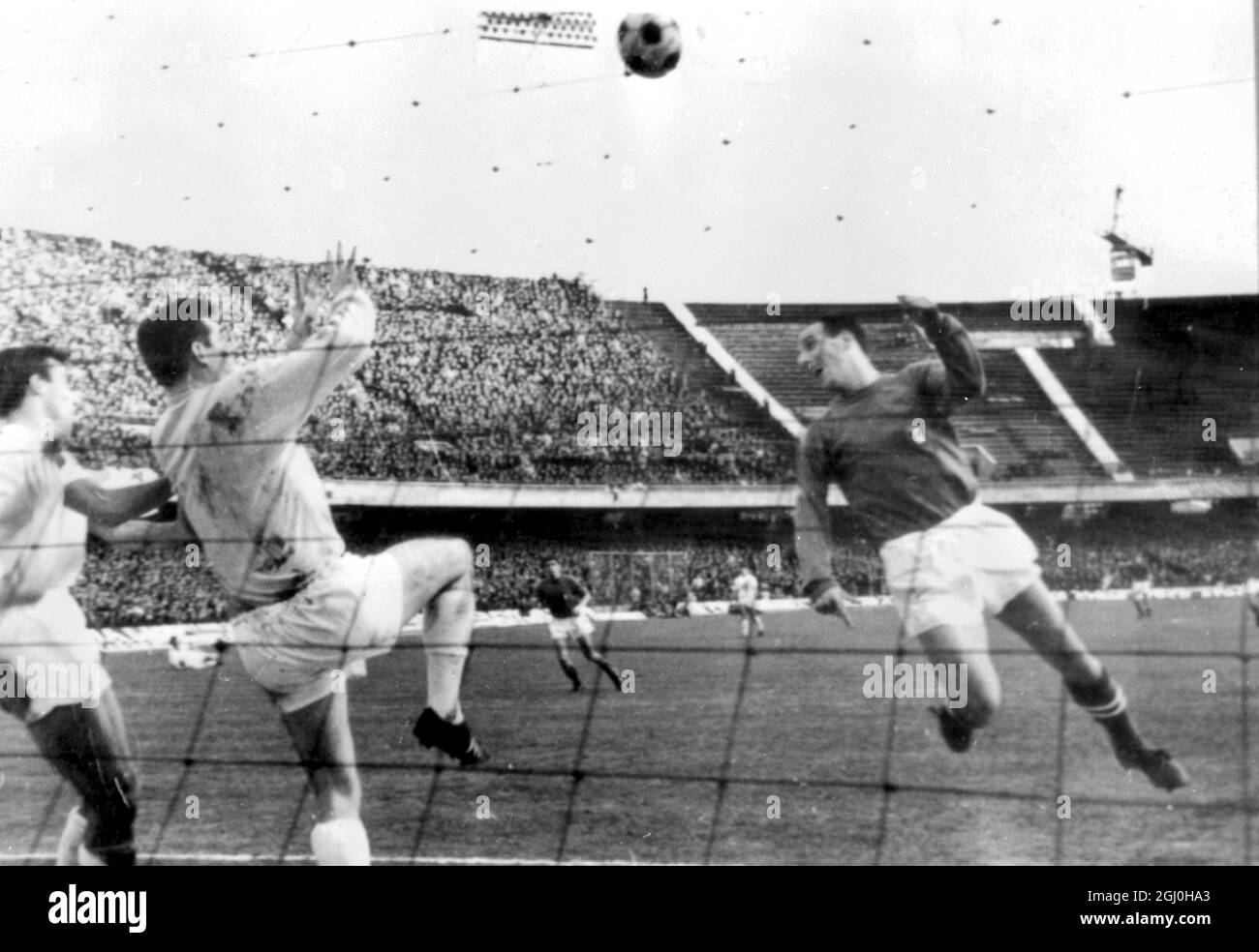 Naples, Italy: Italian left back Facchetti scoring the second goal at the 73rd minute of the second half of today's Italy-Scotland and World Cup Soccer Eliminator which Italy won 3-0. 7 December 1965 Stock Photo