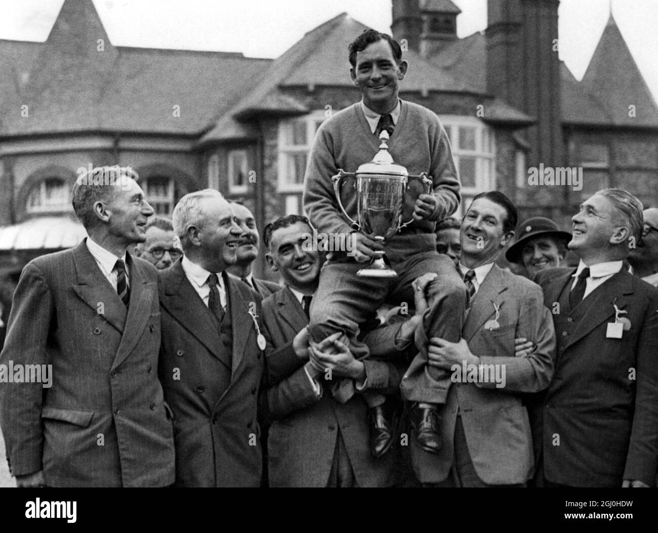 F. Daly is chaired by his Irish contingent of followers after his victory over F. Van Donck (Belgium) in the final of the News of the World Match Play Championship at the Royal Lytham and St. Anne's Course on Saturday. He is the first man to win both the Open and Match Play Championships in the same year. - 28th September 1947 - ©TopFoto Stock Photo