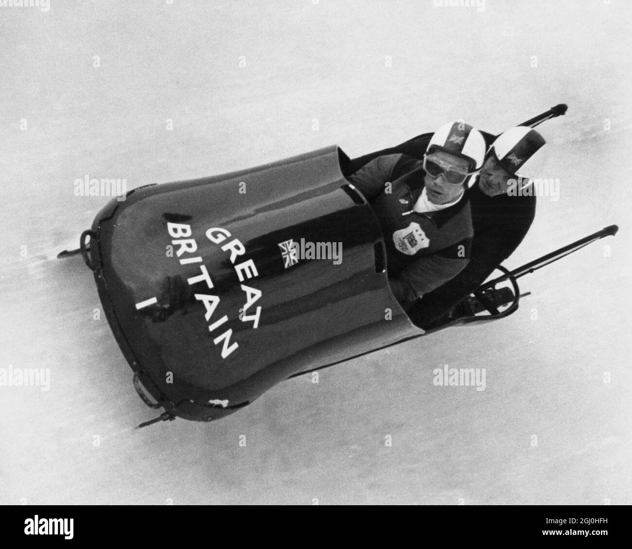 1964 Winter Olympic Games - Innsbruck, Austria Britain's No. 1 team Antony Nash (pilot) and Robin Dixon hurling down the bob run at Igls when the team won a gold medal for Britain - Britain's first gold medal in the Winter Olympics for 12 years. Britain's last gold success was by Jeanette Altwegg in the women's figure skating.- 3 February 1964 ©TopFoto Stock Photo