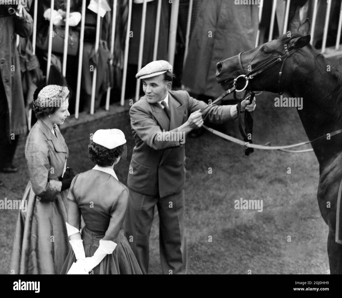 Choir Boy the 4 year old colt has won the Royal Hunt Cup for the Queen Elizabeth II with Princess Margaret and stable boy Geoffrey Woodward June 1953 Stock Photo