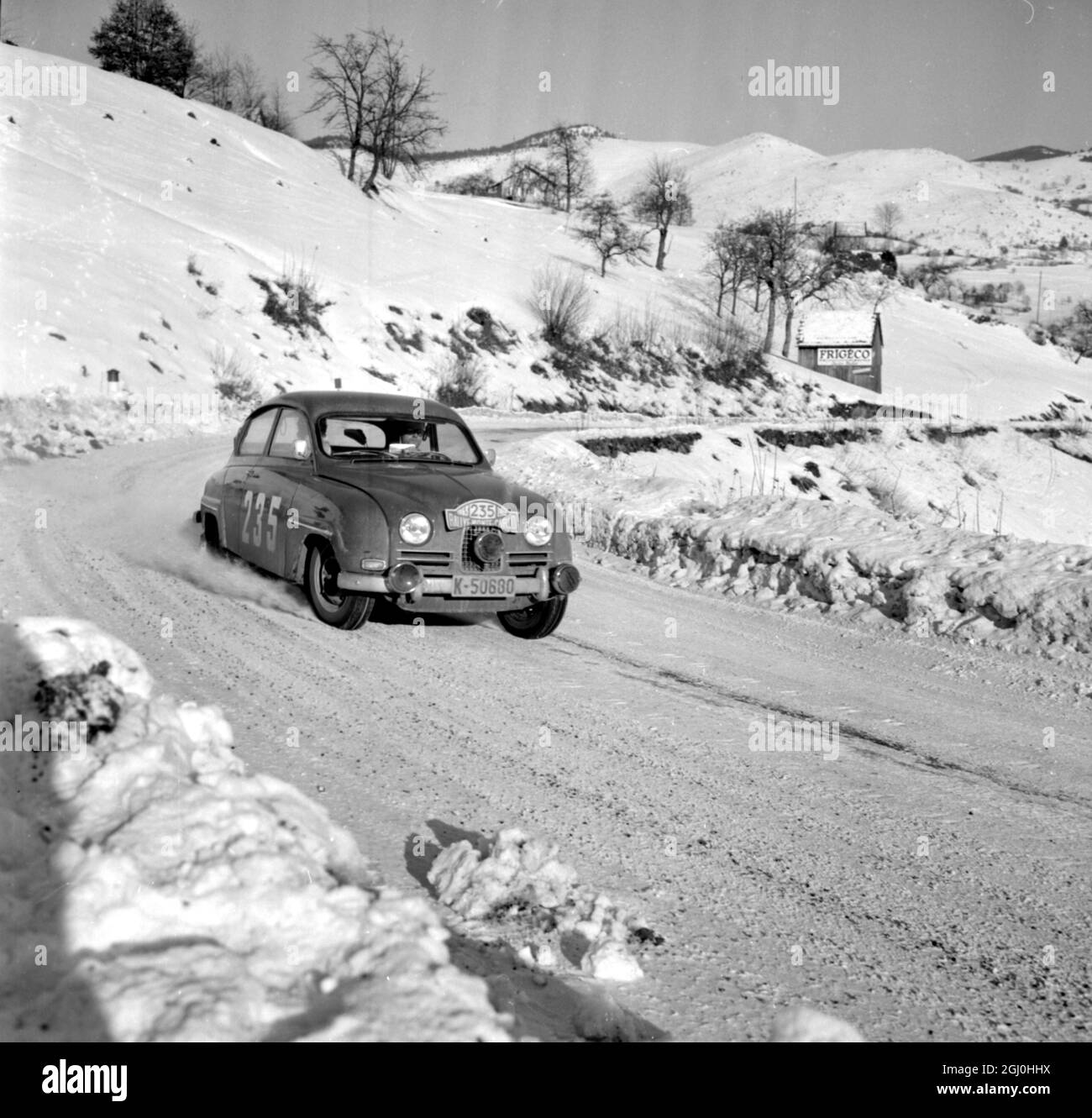 Gerardmer, France: Jens Jernes and Johan Solem, of Norway, pictured in a Saab (No 235) at the Col De La Schlwcht, near Gerardmer, France, during the last few hours of the four day Monte Carlo Rally. They had set out from Stockholm early on Saturday. 22 January 1963 Stock Photo