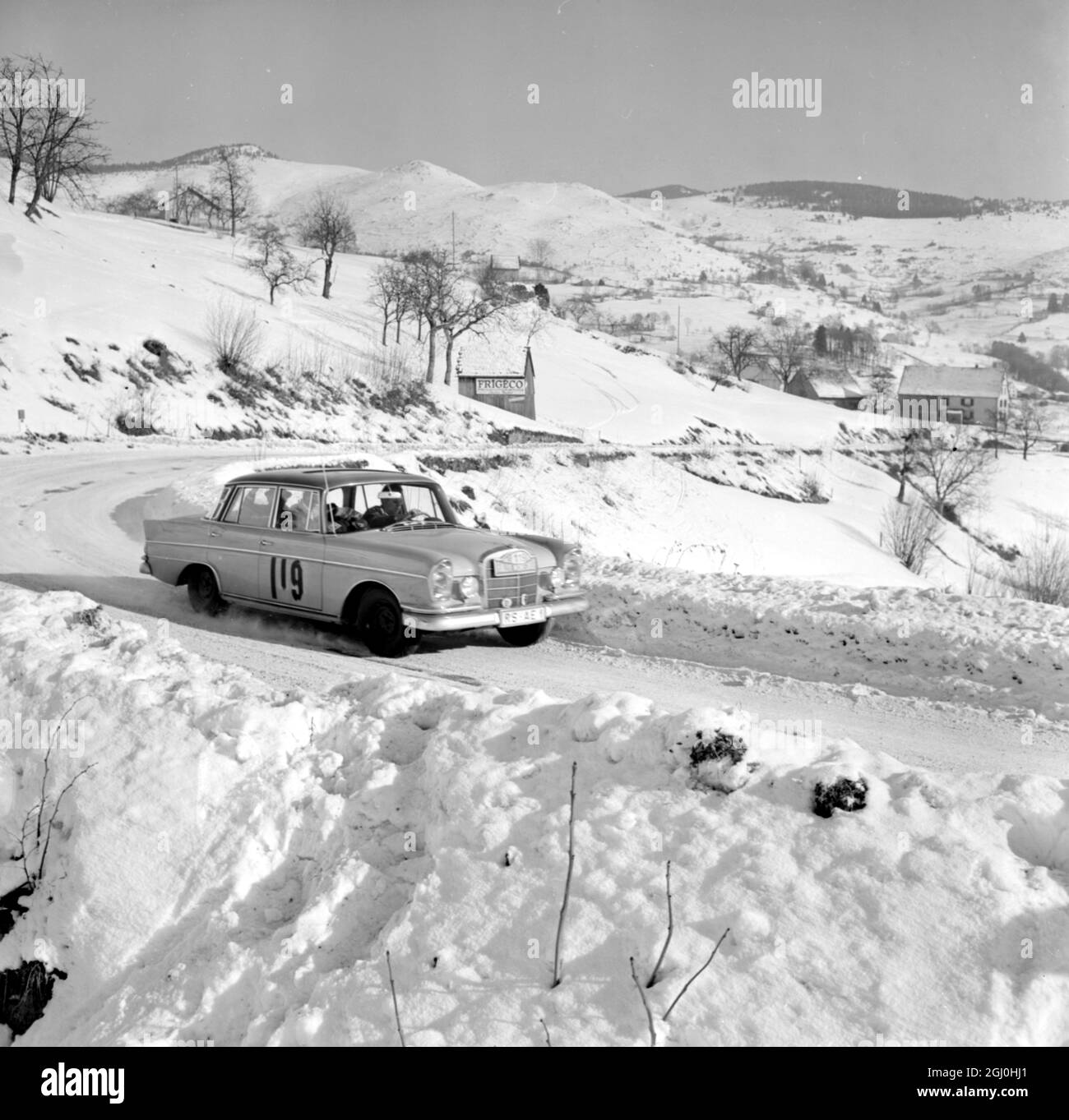 Gerardmer, France: The German team of Helmet Felder and Gerd Eifer take their Mercedes through Col De La Schlucht, near here, yesterday, as they near the end of this year's Monte Carlo Rally . The German pair started out on the rally from Frankfurt 22 January 1963 Stock Photo