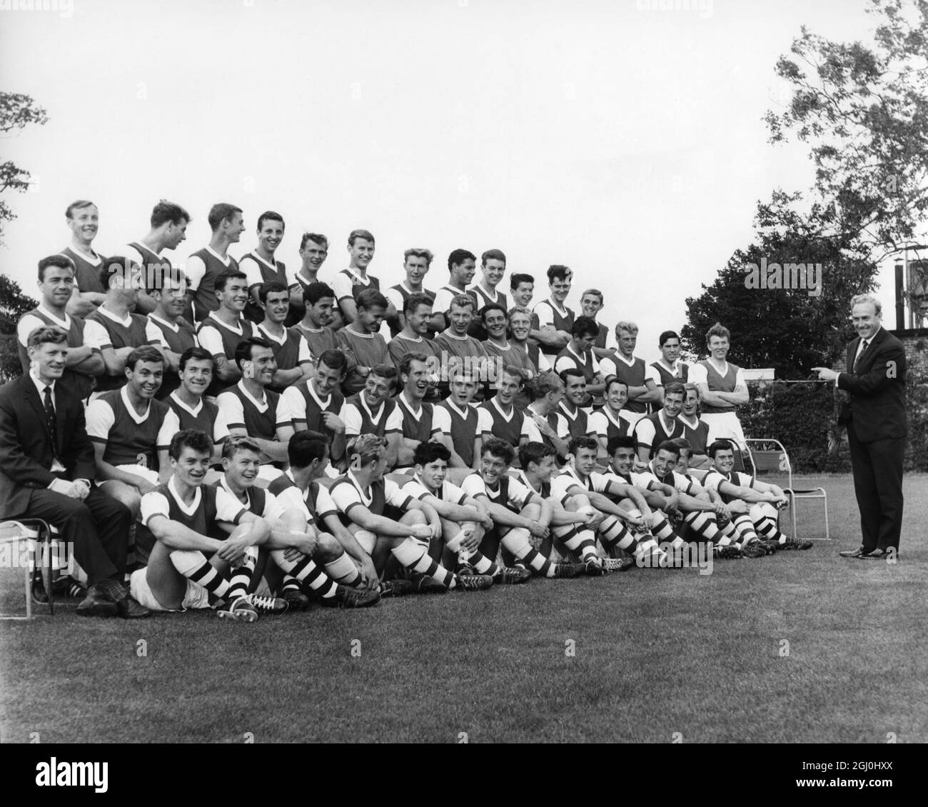 Billy Wright the Arsenal Manager and former England captain looks at a group of the Arsenal players 12th August 1963 Stock Photo