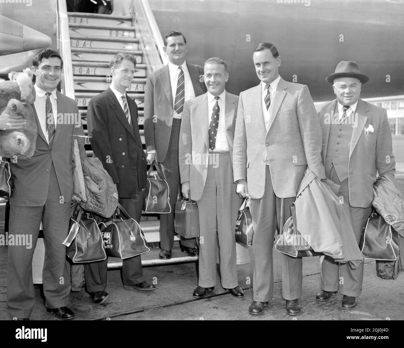 London: more of the England cricketers arrived at London Airport today, following their cricketing tour of Australia and New Zealand Left to Right at the Airport are, Feddie Truman; John Mortimore; Tom Graveney; Willie Watson; Captain Peter May, and Baggage Master, George Duckworth. 23 March 1959 Stock Photo