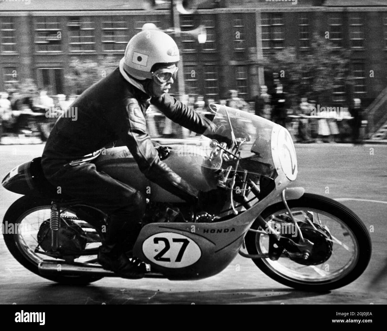 Isle of Man: One of the Japanese team members T Tanaka speeds round thes maller Clypse circuit here on a Japanese Honda 125cc machine, rehearsing for the TT races. 27th May 1959 Stock Photo