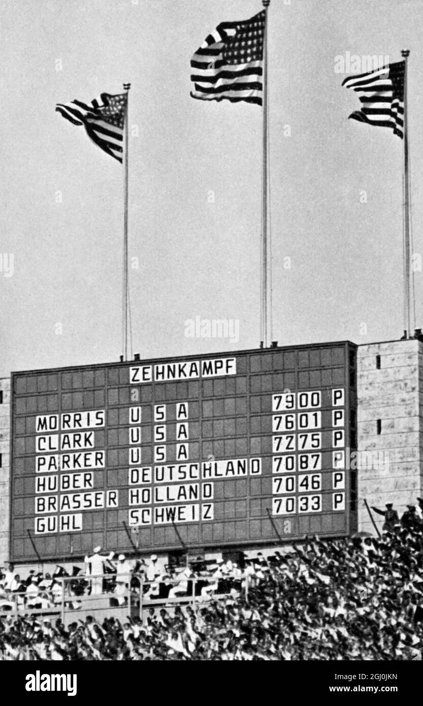 1936 Olympics, Berllin - The USA celebrated their success in the decathlon. Their flag flew at all three masts..... In order were: Glenn Morris, Robert Clark, John Parker, Huber (Germany), Brasser (Holland) and Guhl (Switzerland). (Die USA feierten im Zehnkampf ihren schonsten und wertvolisten Erfolg. An allen drei Masten wehte das Stemenbanner.) ©TopFoto Stock Photo