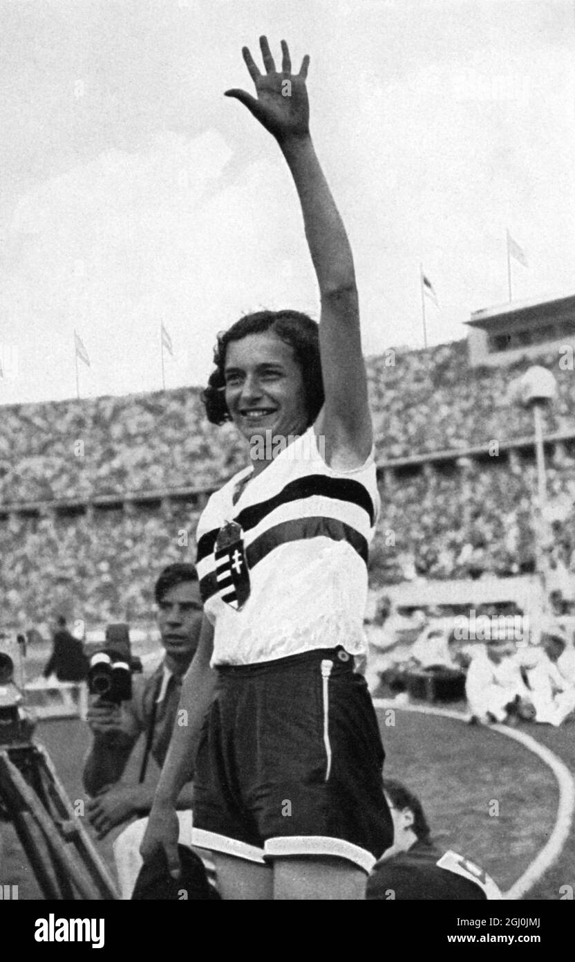 1936 Olympics, Berlin - Ibolya Czak waves to her jubilant compatriots from Hungary as she won the gold medal in the highjump. ( Ibolya Czak winkty ihren jubeinden Landslcuten aus Ungam zu, denn sie hat eben die Goldmedaille im Hochsprung gewonnen.) ©TopFoto Stock Photo