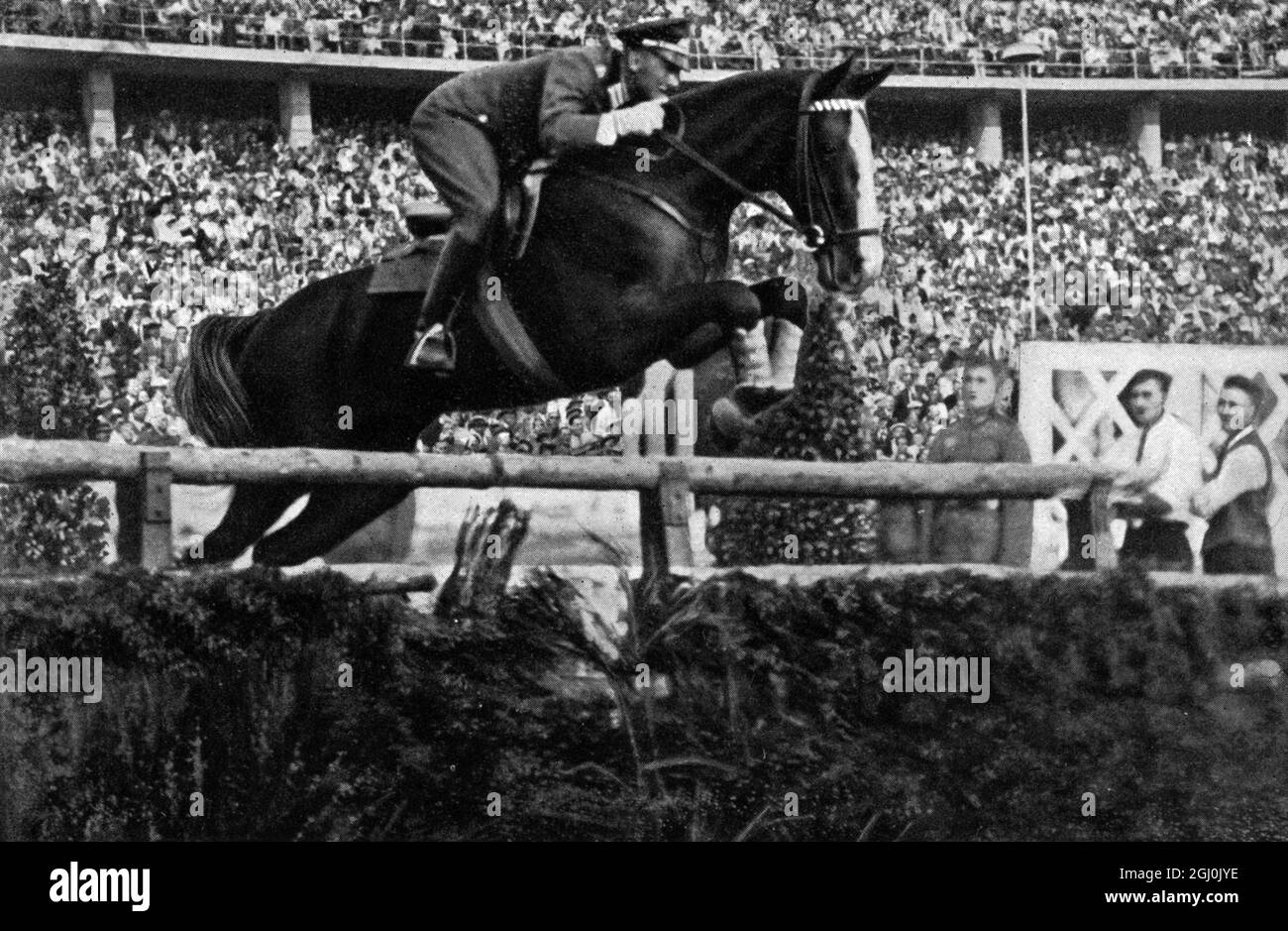 1936 Olympics, Berlin - Riding - First Lieutenant Kurt Hasse, winner on Tora in the show jumping event. (Oberleutnant Kurt Hasse auf ''Tora'' siegte durch einen grossartigen Ritt im grossen Jagdspringen.) ©TopFoto Stock Photo