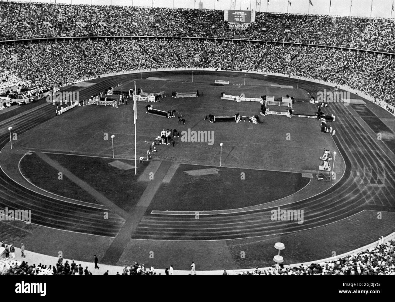 1936 Olympics, Berlin - Riding - The conclusion of the hunt jumping ''price of the nations'' took place on the last day of events in the Olympic Stadium. (Als sportlicher Abschluss fand am letzten Tage der Spiele im Olympiastadion das grosse Jagdspringen, der ''Preis der Nationen'' statt.) ©TopFoto Stock Photo