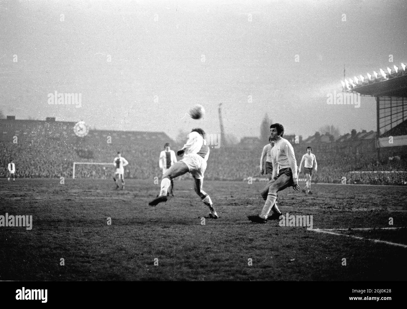 European Fairs Cup Semi-Final 1st Leg. Arsenal V Ajax Eddie Kelly of Arsenal (centre) heads the ball away during an Ajax attack in the European Fairs Cup Semi-Final at Highbury. On the extreme left is Charlie George and on the right is Frank McLintock: and extreme right (background) is Jon Sammels. 8th April 1970 Stock Photo