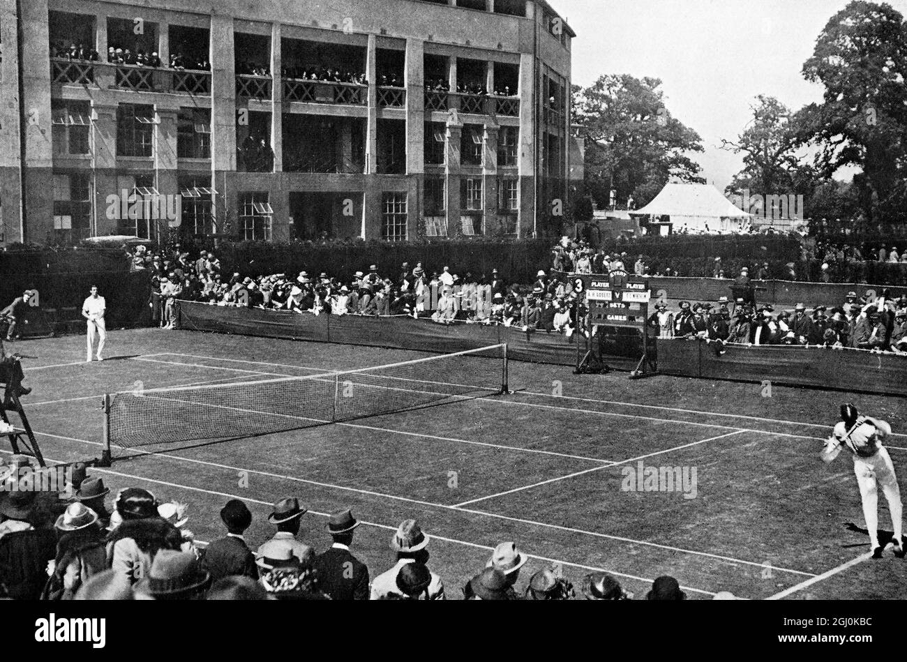 The New Wimbledon: a view of the outside courts with R. Wertheim (Australia) v. A. H. Gobert (France) - 1922 ©TopFoto Stock Photo