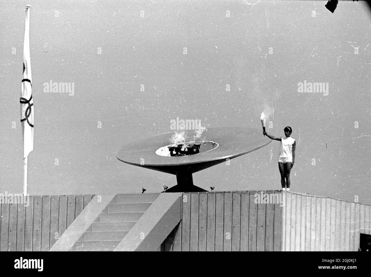 Mexico City: High above the Olympic Stadium the Mexican hurdler, Enriqueta Basilo, lights the flame for the 1968 Olympics. She is the first woman in the history of modern Olympics to have the honour. The ceremony signalled the start of the games on October 12. 15 October 1968 Stock Photo