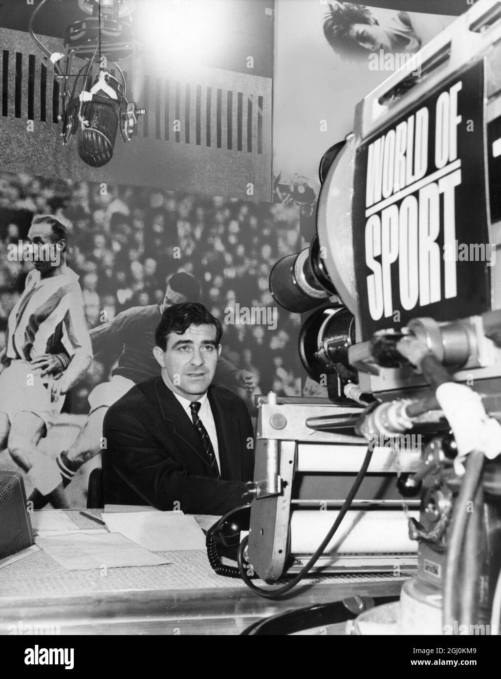 Freddie Trueman, Yorkshire fast bowler, faces the TV cameras as a sports commentator for ITV ''World of Sport'' alongside Eamonn Andrews. 1965 Stock Photo