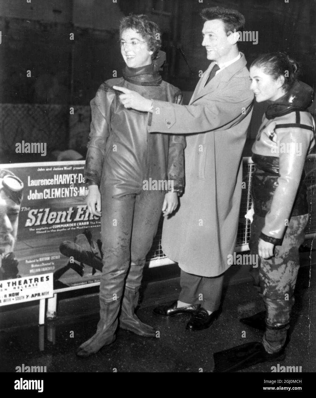London England Exhibition Underwater Equipment 25 year old Rowena Ker of Stourbridge Worcestershire in frogman outfit with club member Paddy Mangin and film and stage actor Laurence Harvey . 25 March 1958 Stock Photo