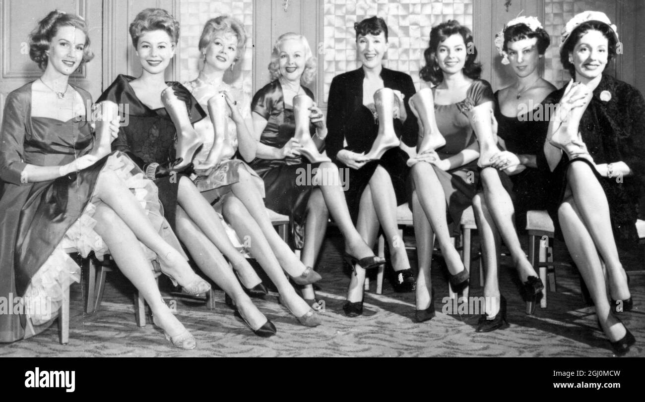 All set in New York for inspection and holding their '' Golden Stocking Awards '' are the women voted by the National Association of Hosiery Manufacturers as the women in America with the most beautiful legs . Left to Right Barbara Britton ( television ) , Mitzi Gaynor (motion pictures ) Monique Van Vooren (supper clubs ) Hope Hampton (society) Gypsy Rose Lee (literature ) Anne Lane ( Stage ) Gussie Moran (sports) and Marguerite Piazza (opera) 23 March 1958 Stock Photo