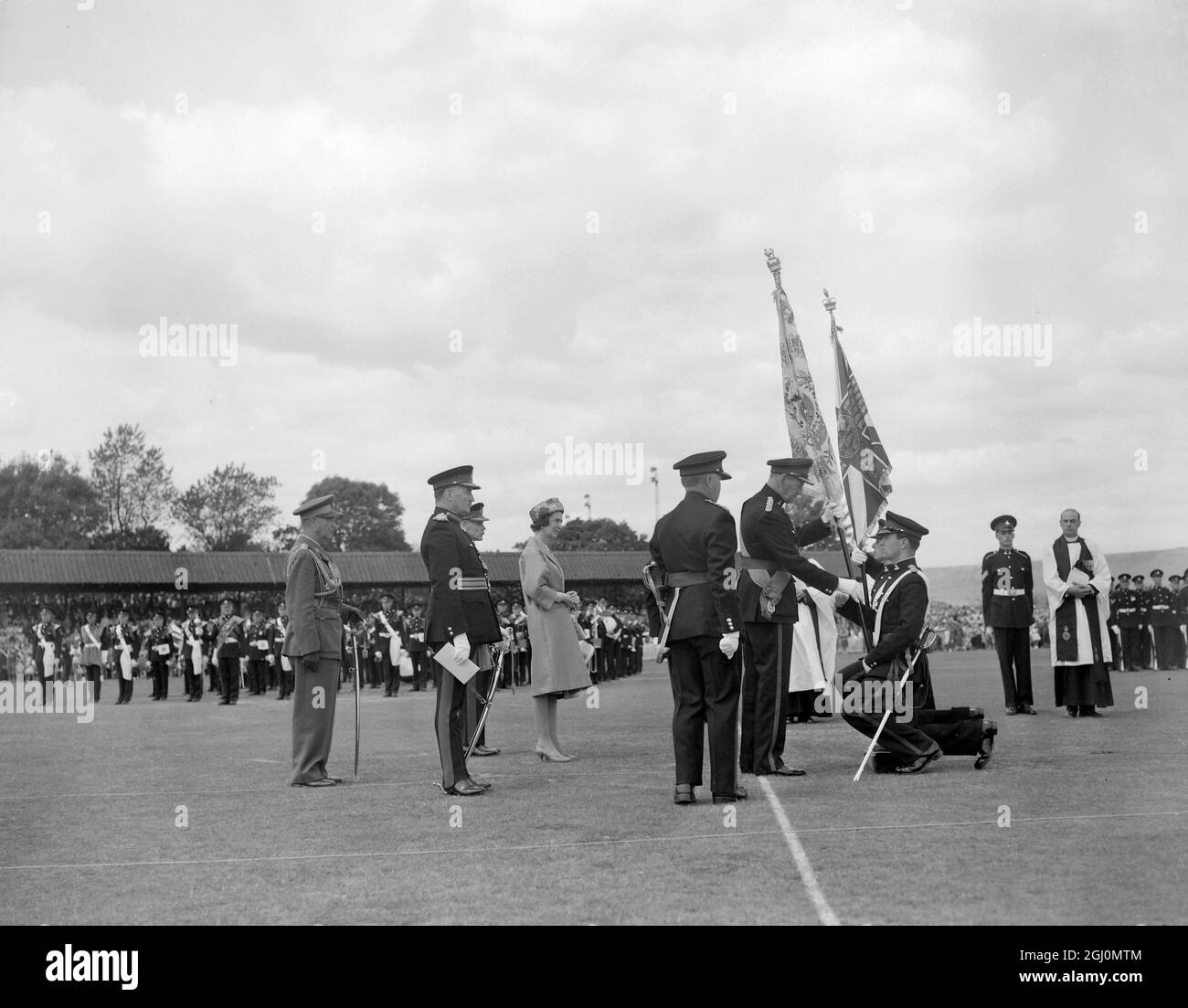 Folkestone - England - King Frederik of Denmark - Colonel in Chief of the Queen's own Buffs - presenting new colours to the Royal Regiment at a tradition filled ceremonial parade on Fokestone Cricket Ground . The colours prsented resulted from the amalgamation of the buffs ( Royal East Kent Regiment ) and the Queen's own Royal West Kent Regiment in March 1961 - watching to the left is Princess Marina - Colonel of the Regiment - 23rd June 1962 ©TopFoto Stock Photo