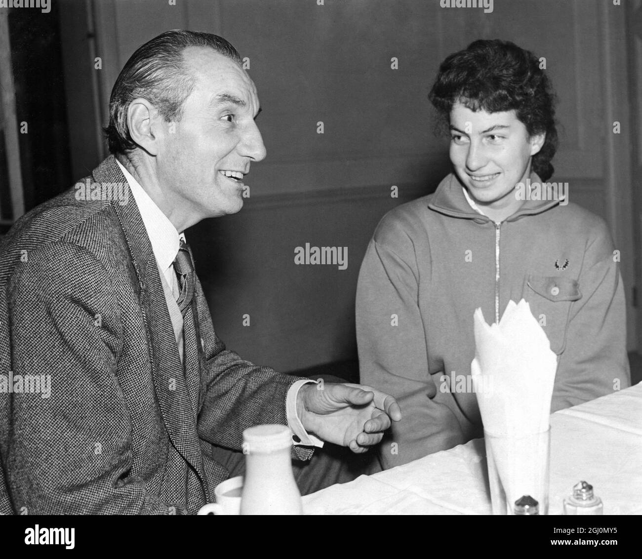 Virginia Wade , 16 year old daughter of a former Archdeacon of Durham , chatting with Fred Perry at Queen's Club , London , England . Virginia showed that she is one of the most promising youngsters to arrive on the British Lawn Tennis scene for some years 3 January 1962 Stock Photo
