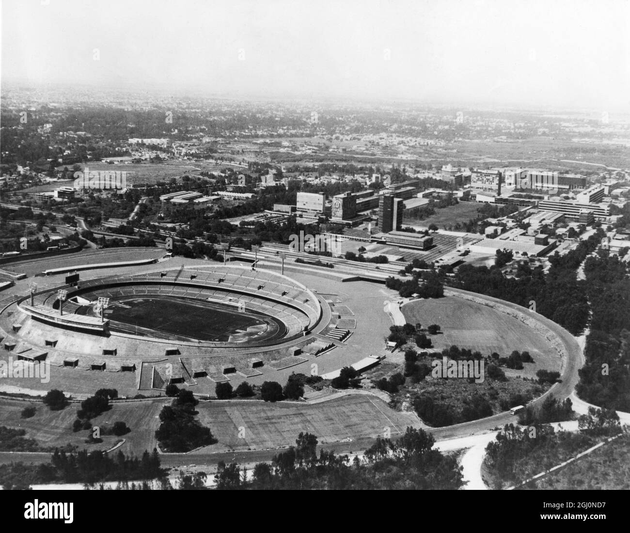 An aerial view of the Olympic Stadium and surrounding area of the Mexico City university . The Stadium , which is situated in the grounds of the University , has a capacity of 80,000 and will be one of the venues for the 19th Olympiad , due to begin in Mexico in 1968 Stock Photo