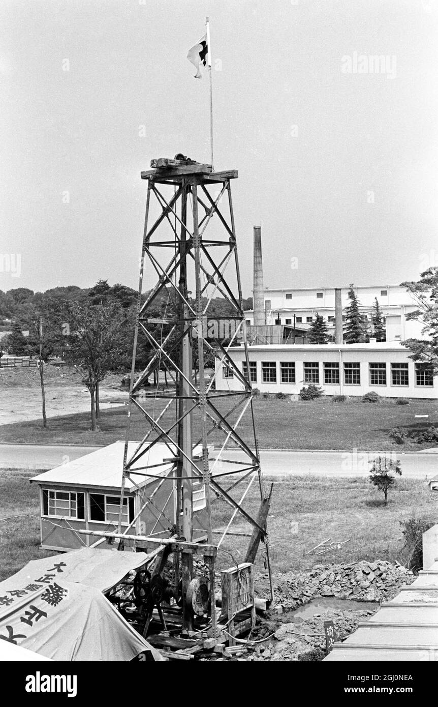 Owing to the serious current shortage of water in the Metropolitan area of Tokyo, the city authorities decided to sink several wells in the grounds of Olympic village in an effort to allay any possible shortage of water during the Olympic Games, opening October 10th and here, a well is seen being suck in the village grounds August 18th 1964 Stock Photo