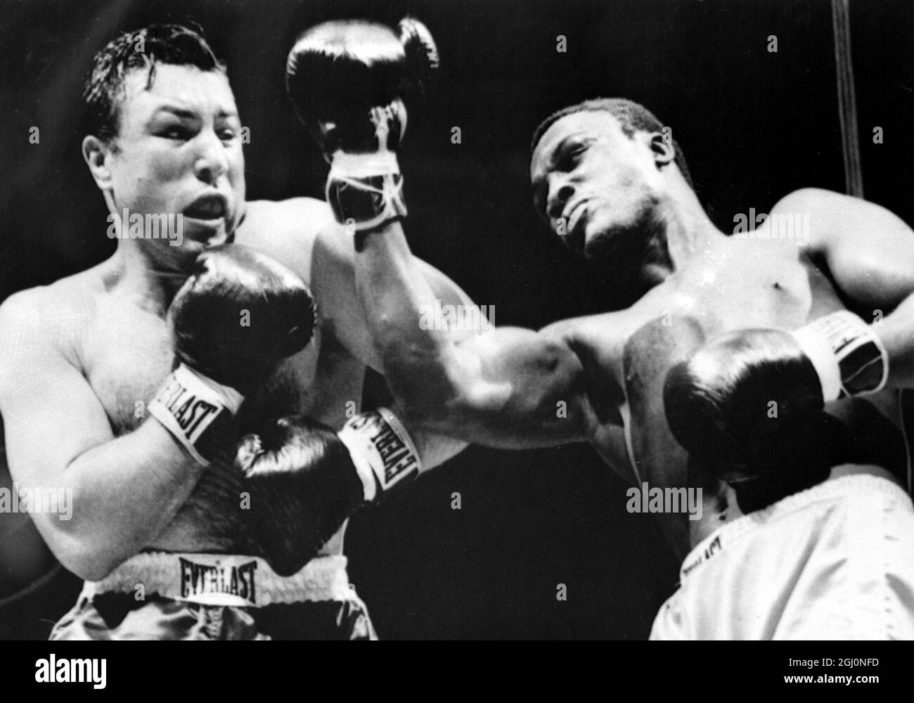 Joe Frazier (right) misses a right to the head of Canadian heavyweight George Chuvalo during the first round of their scheduled 12-round contest . Frazier won with a technical knockout when the referee stopped the contest in the fourth round . 20th July 1967 Stock Photo