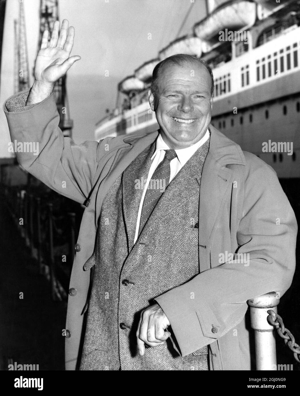 Commander Alan Villiers , the Australian born sailor - author who captained the Mayflower II , replica of the Pilgrim Fathers' ship , on her voyage from Britain to the United States , is pictured at Southampton , England , on his arrival from New York in the Cunard liner Queen Mary . 27 August 1957 Stock Photo