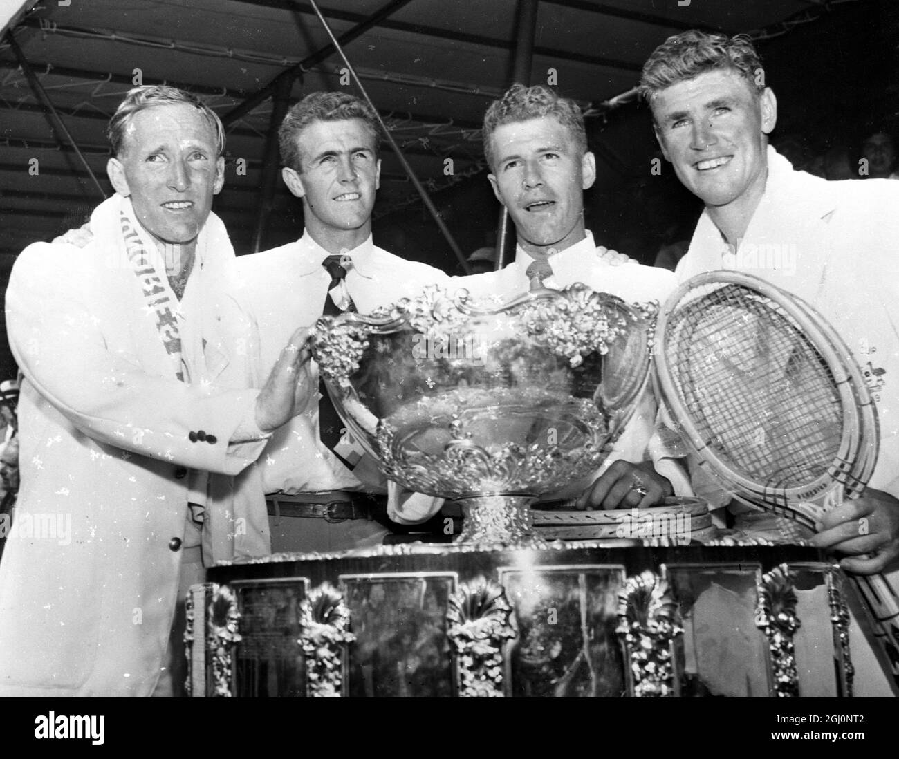 Victorious in pivotal doubles match , Australia's John Bromwich and Frank Sedgman pipped the Davis Cup from Americas clutches beating Ted Schroeder and Gardner Mulloy . Photos shows members of the Australian team LtoR John Bromwich , Frank McGregor , George Worthington and Frank Sedgman with the Davis Cup 1 September 1950 Stock Photo