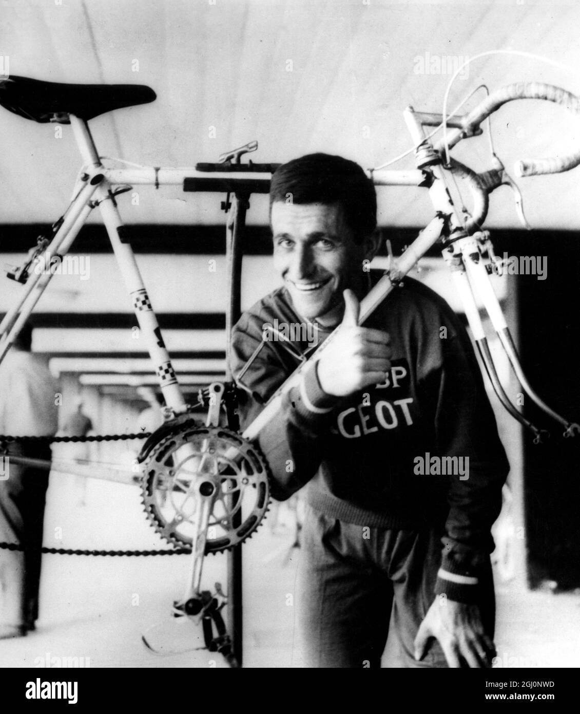 A confident smile and thumbs-up sign from Tommy Simpson , Britain's main hope for success in the Tour de France , on his arrival at Cologne for the first stage which ends at Liege . 23rd June 1965 Stock Photo