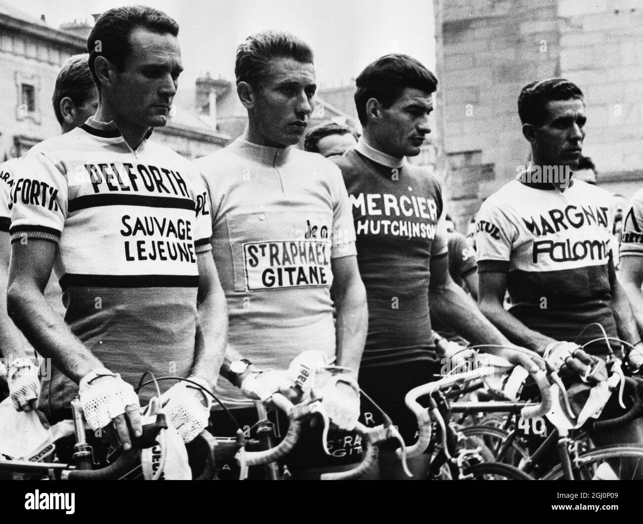 tour de France riders LtoR Henry Anglade ( France ), Jacques Anquetil ( France ), Raymond Poulidor ( France ) and Federico Bahamontes ( Spain ) afre pictured observing a one minute's silence in memory of the eight people who were killed on 8 July at Port-de-Couze , Dordogne , when a police van riding woth the Tour de France cyclists crashed off the road into the spectators . The ceremony was held prior to the start of the 20th stage of the race . 14 July 1964 Stock Photo