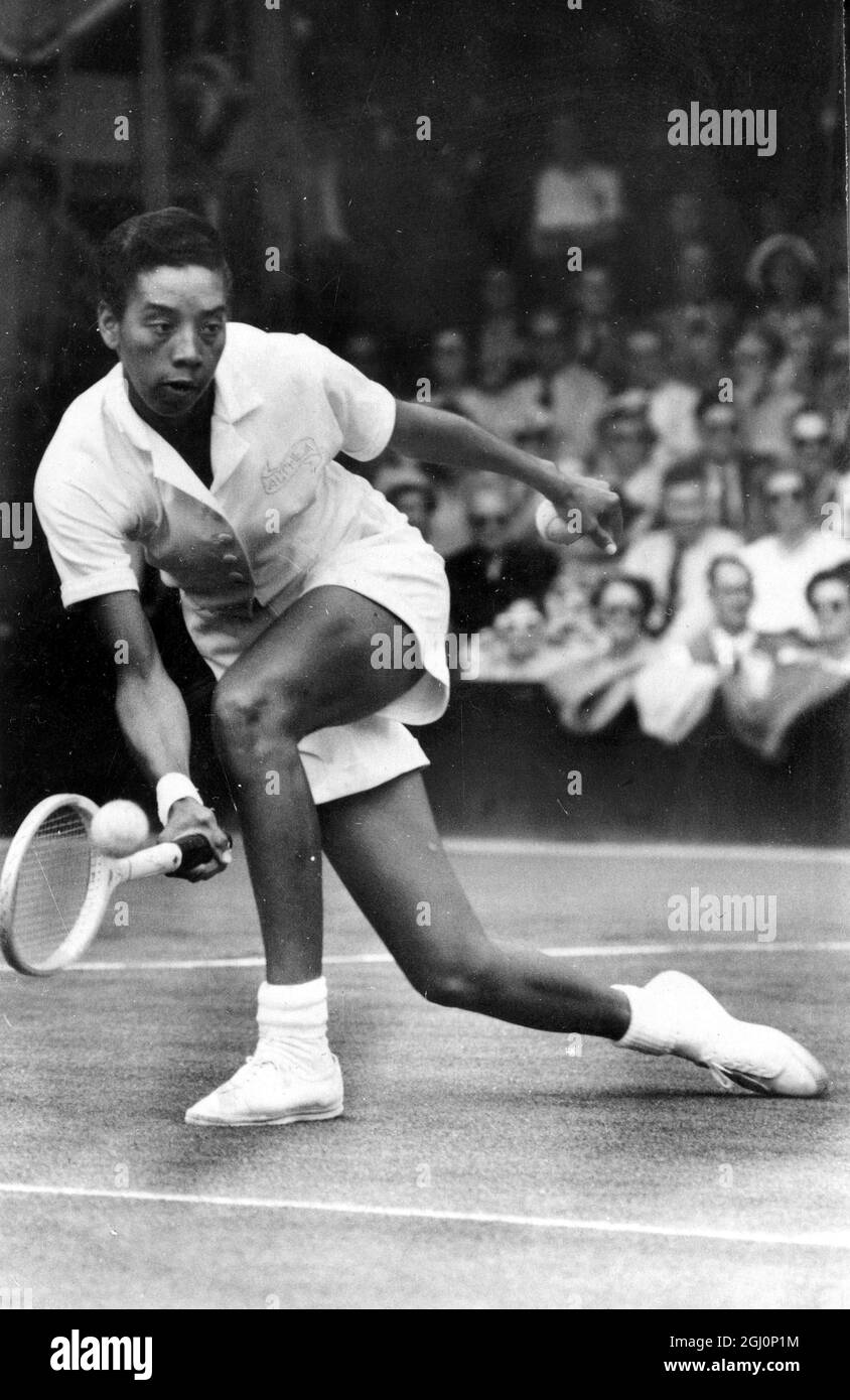 The American tennis player , Althea Gibson , in action against her compatriot , Beverley Baker , during their singles match at Wimbledon tennis championships , in London . 29 June 1951 Stock Photo