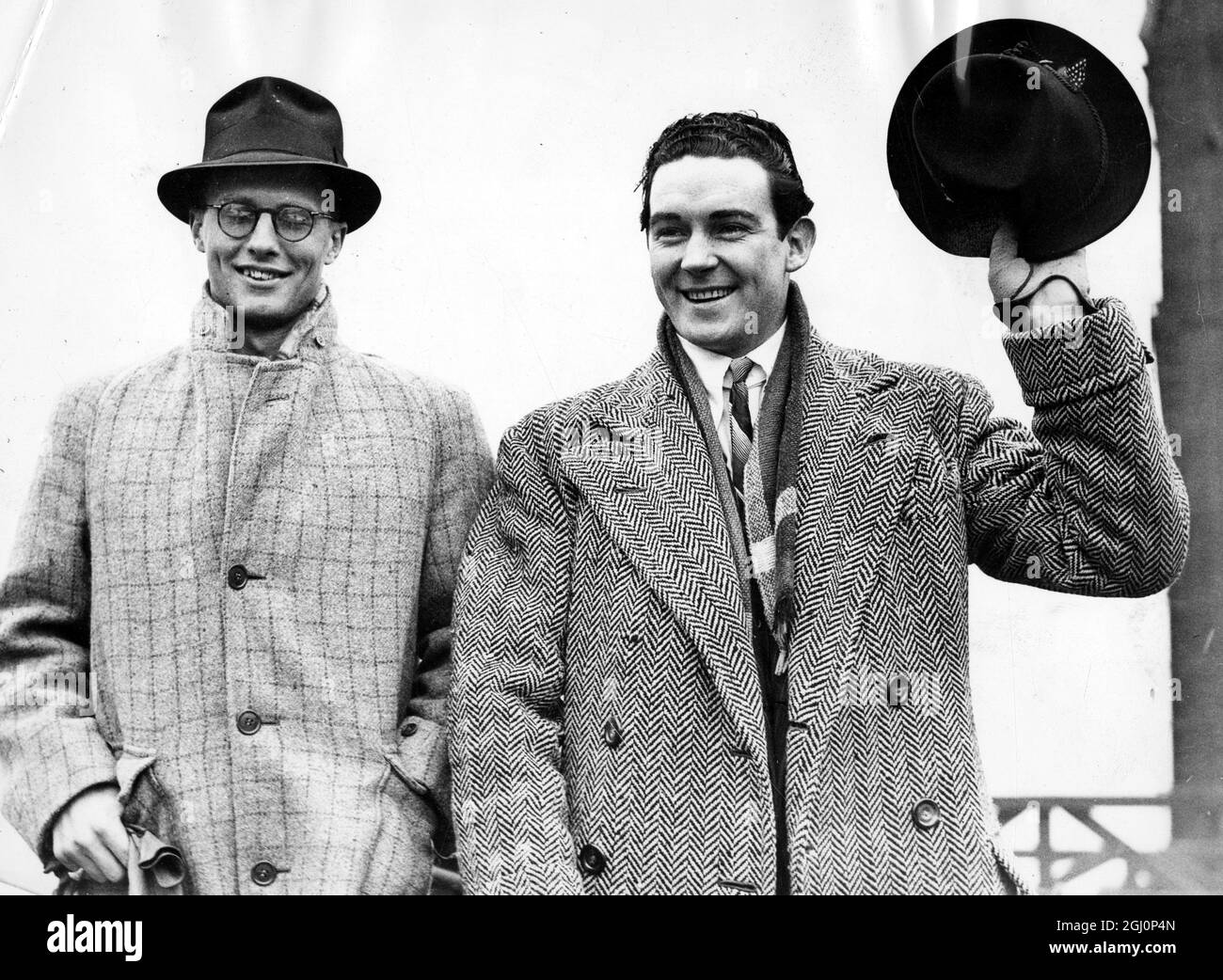 Jack Doyle arrives home with Judith Allen's brother. Jack Doyle, Irish heavyweight boxer, singer and film actor, was accompanied by Mr John Eliot, brother of his wife, Judith Allen, when he arrived at Southampton on the record-breaking liner Normandie from America. 23 March 1937 Stock Photo