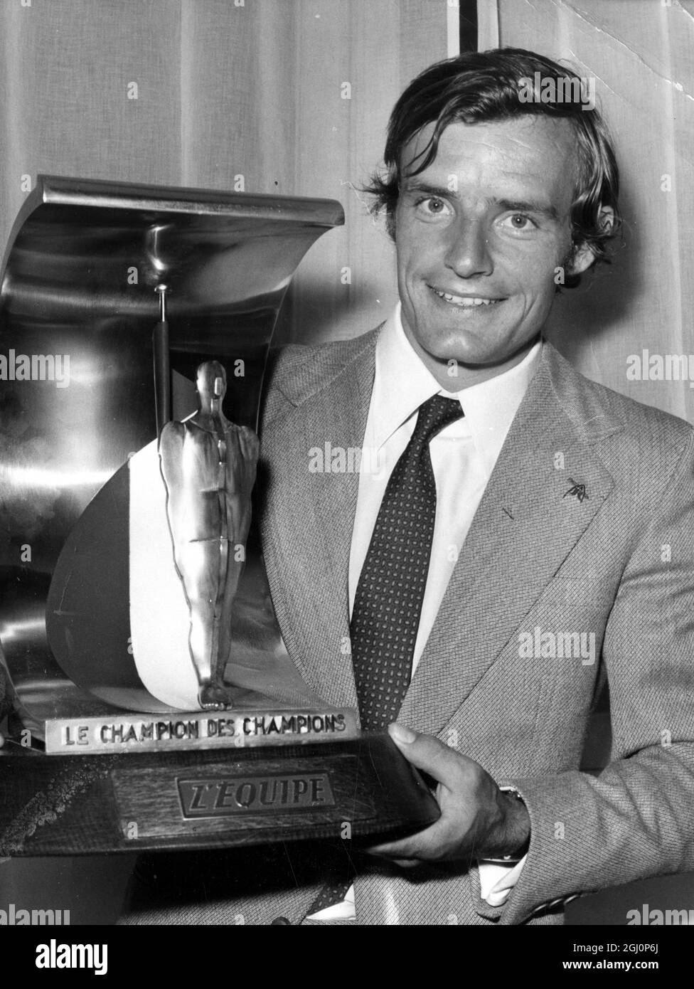 French World Cup alpine ski racer Jean Claude Killy holds up a trophy