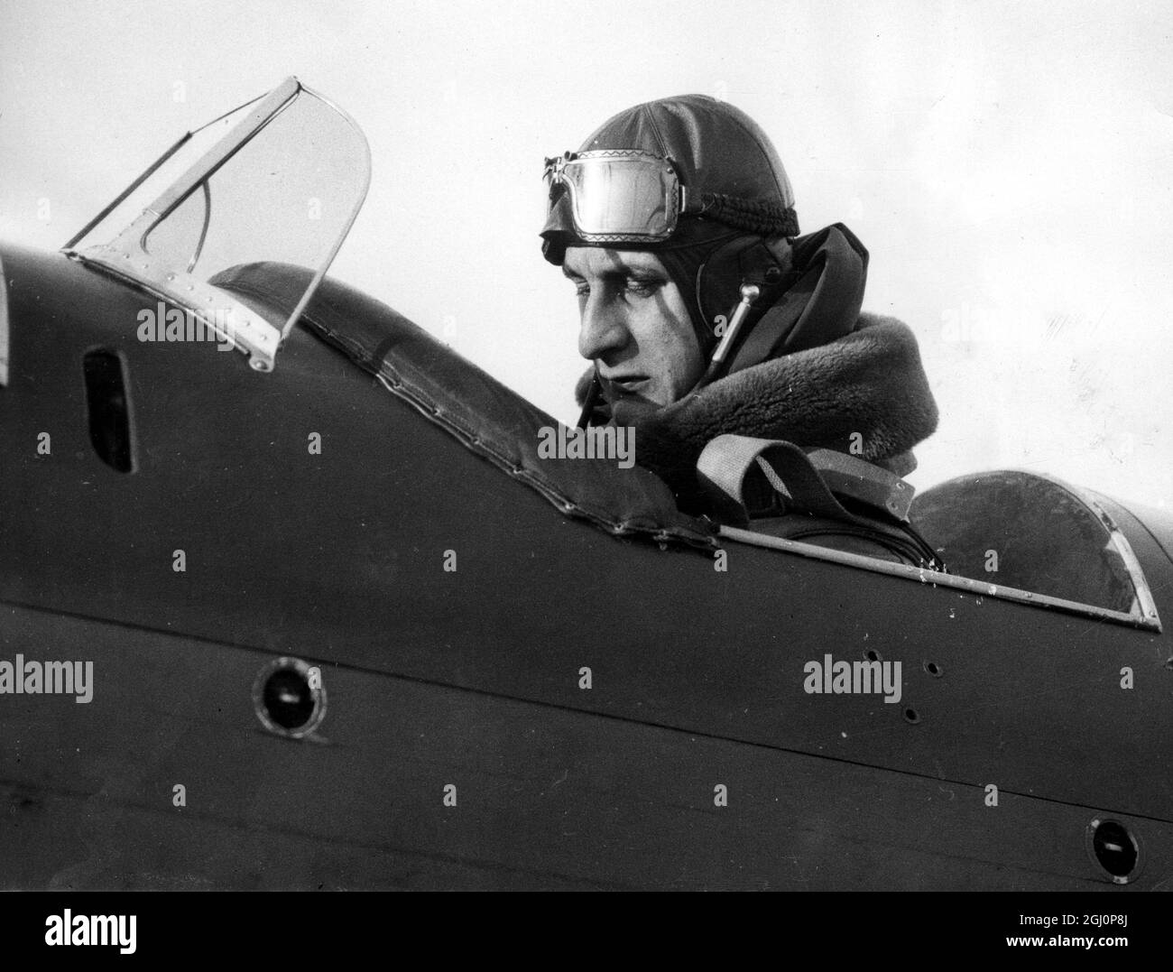 Obolensky, Oxford's rugby football ace, is member of air squadron. Wants to become a pilot. Prince Alexander Obolensky, in the cockpit of the Oxford University Air Squadron headquarters, Shippen, near Abingdon, Berkshire. 28 November 1936 Stock Photo