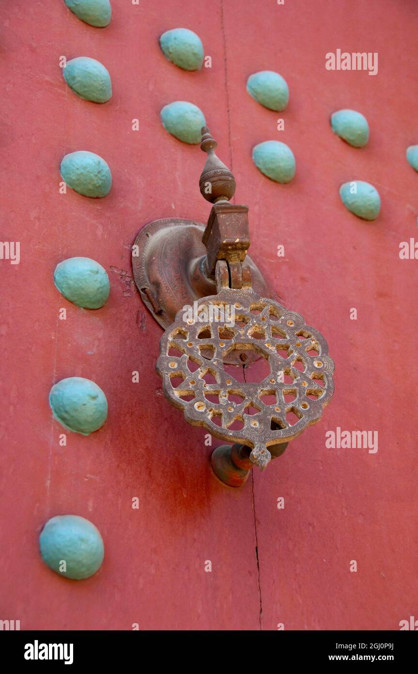 Africa, Morocco, Casablanca. Mahakma Law Courts (aka Mahakma du Pacha) home to the Islamic law courts. Door knocker on heavy wooden door. Stock Photo