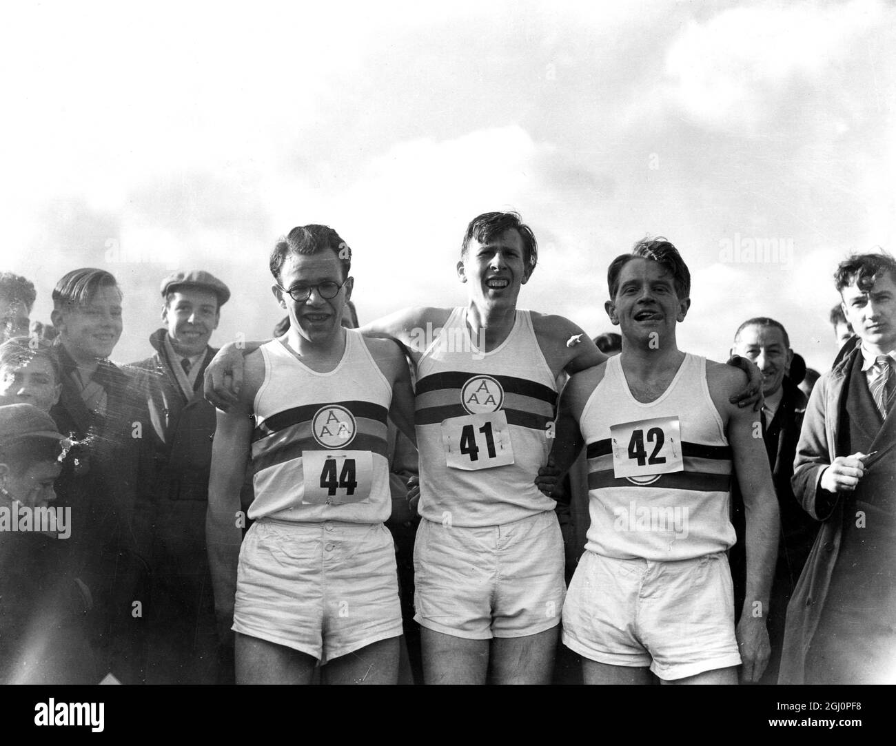 Roger Bannister breaks the mile world record Roger Bannister (centre) with the men that made his world record possible , Chris Brasher and Chris Chataway (right) at Oxford Bannister 's time was 3 minutes 59.4 seconds. 6 May 1954 Stock Photo