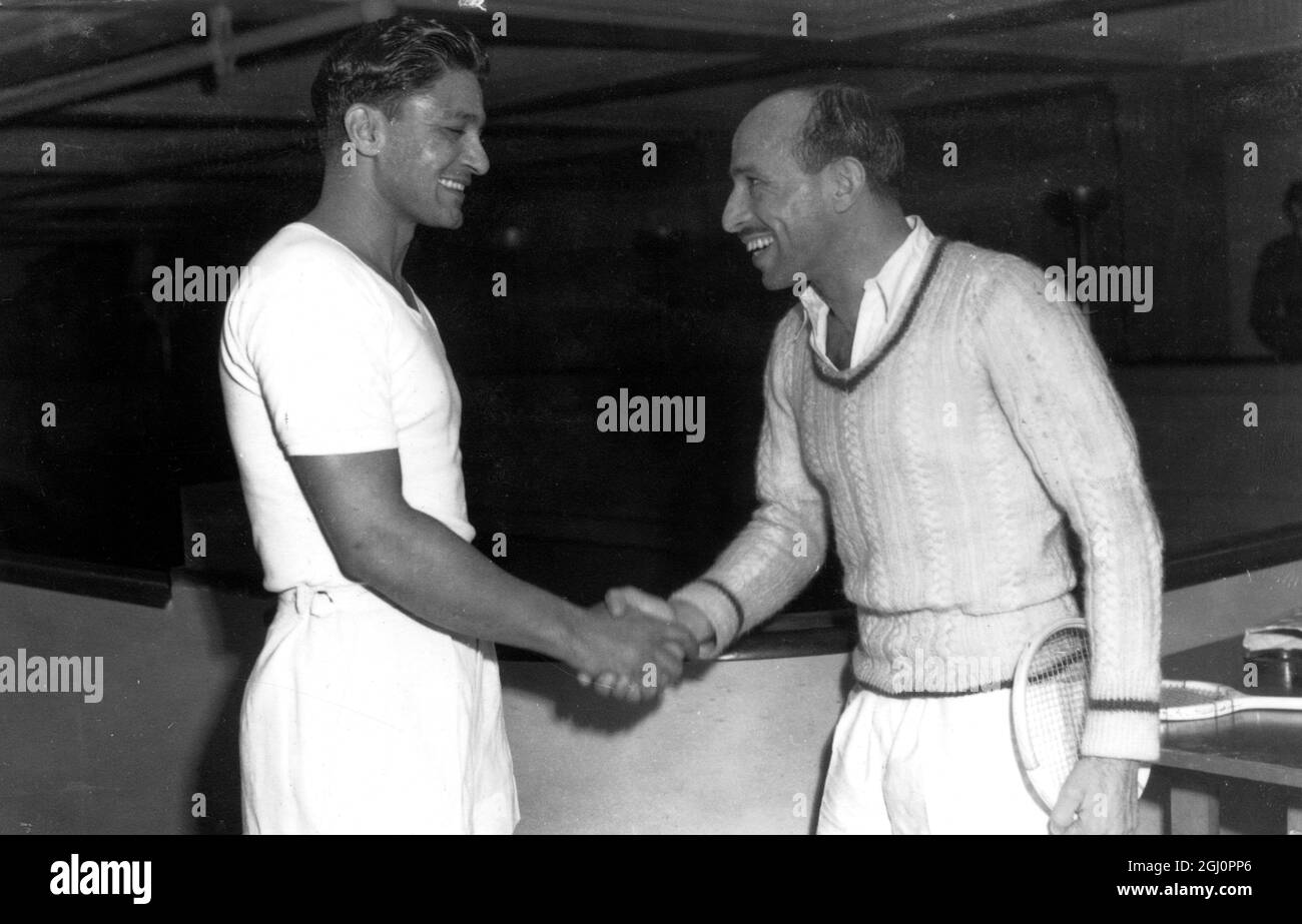 Hashim Khan wins professional squash rackets championships at the Lansdowne Club . London ; Hashim Khan of Pakistan , winner of the Professional Squash Rackets Championship at the Lansdowne Club , shakes hands with Abdul Bari , of India ( left ) after beating him by three games to two to win the championships. 13 March 1951 Stock Photo